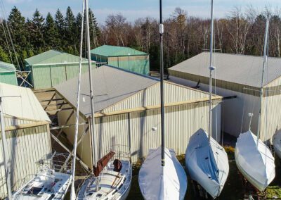 mast up sailboats and storage buildings